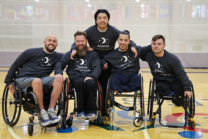 wheelchair rugby players in Saatva sweatshirts.